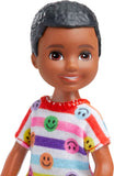 Barbie Chelsea Doll, Small Boy Doll Wearing Removable Romper and Shoes with Brown Hair & Brown Eyes Blue Eyes